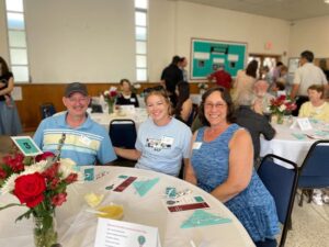 Beth Kasper welcoming new friends at the Aphasia Awareness Dinner 2023.